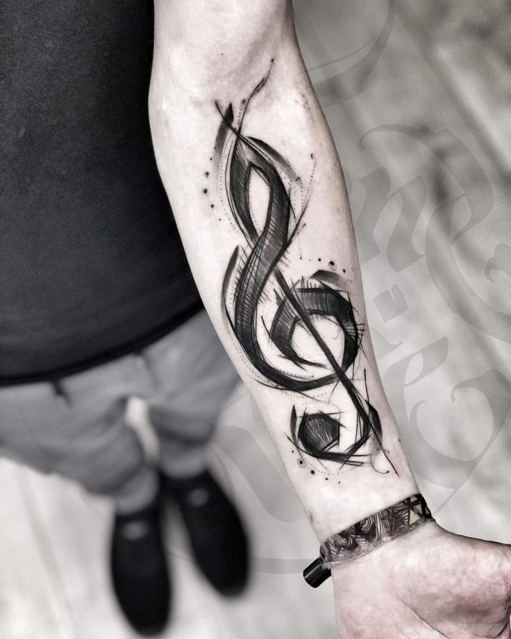 Tatuagem de musica no braço